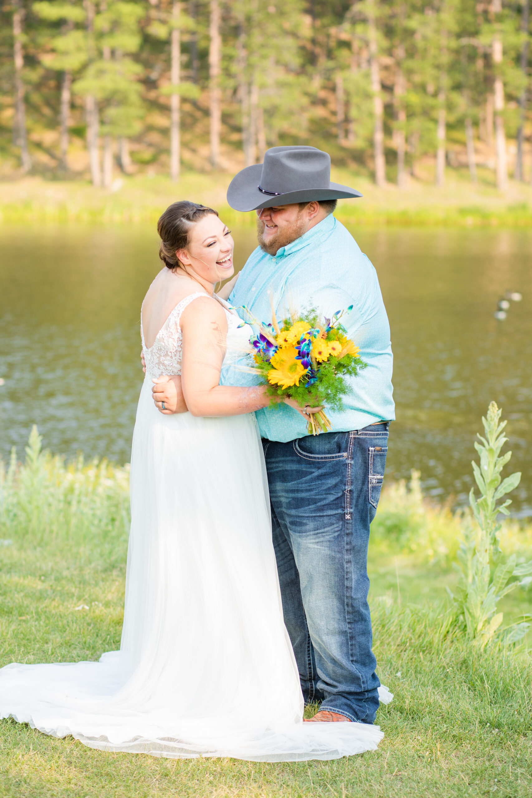 bride and groom laughing on their wedding day