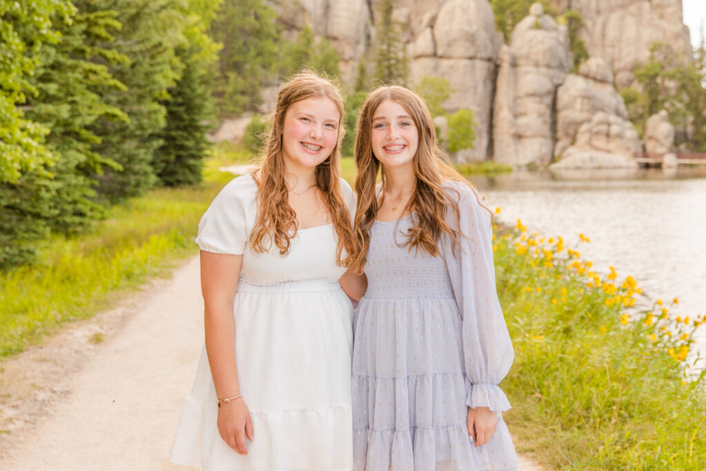 photos of two girls near water for a photos session