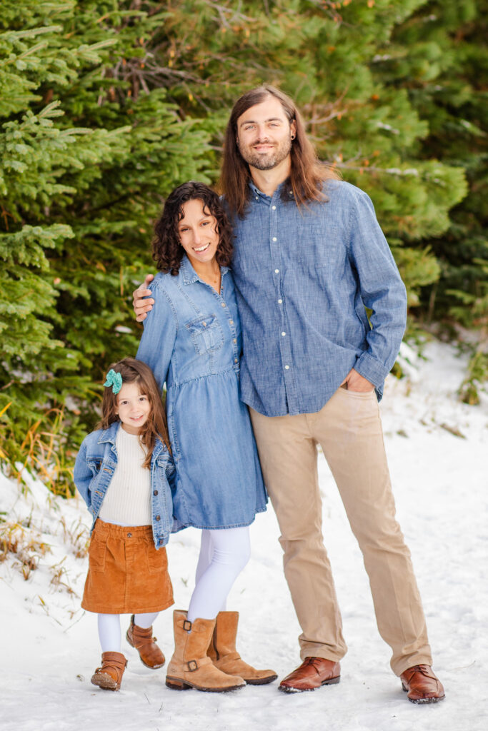 family of three in the beautiful black hills with snow