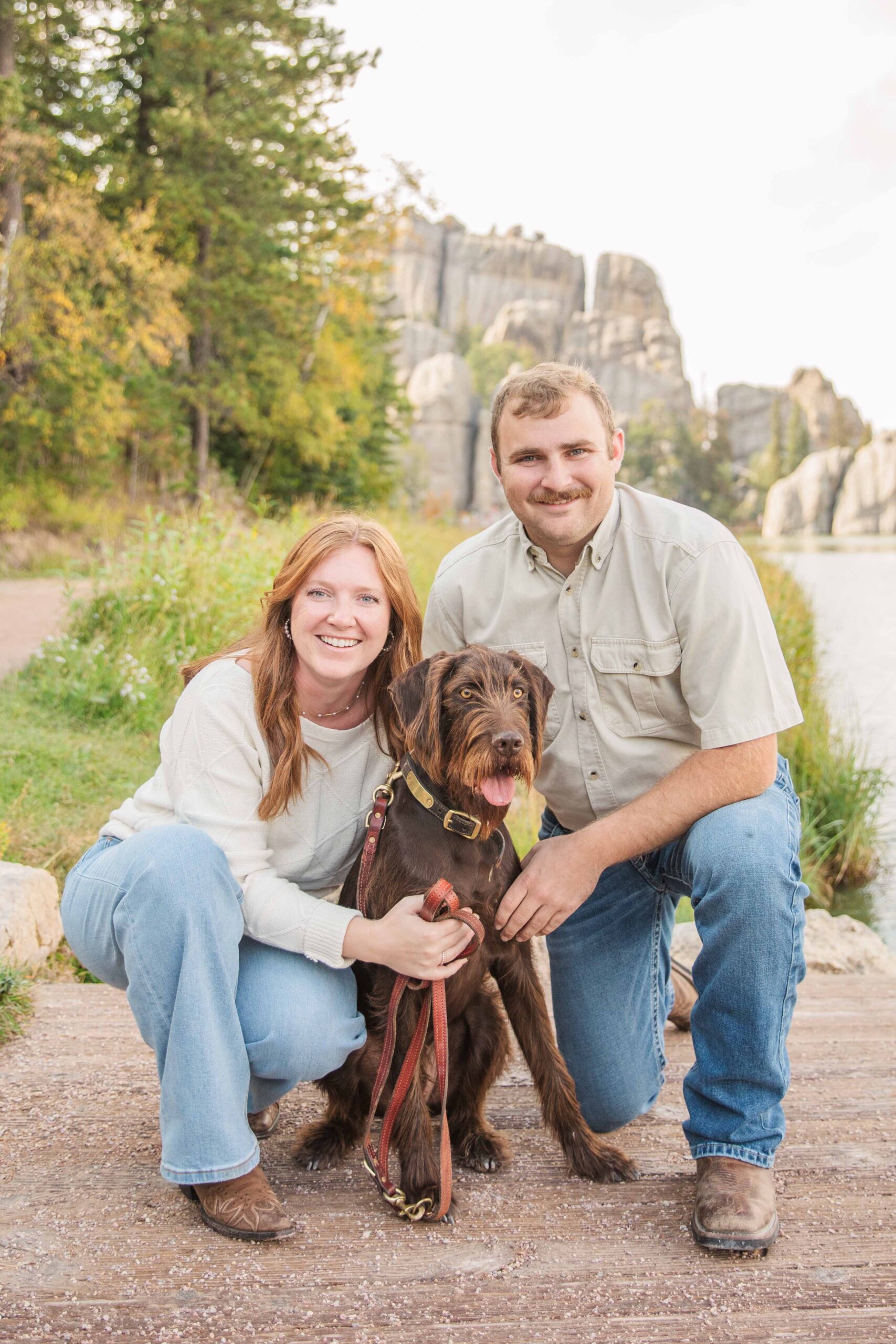 A Sylan Lake Custer State Park family session with the water and rocks in the back